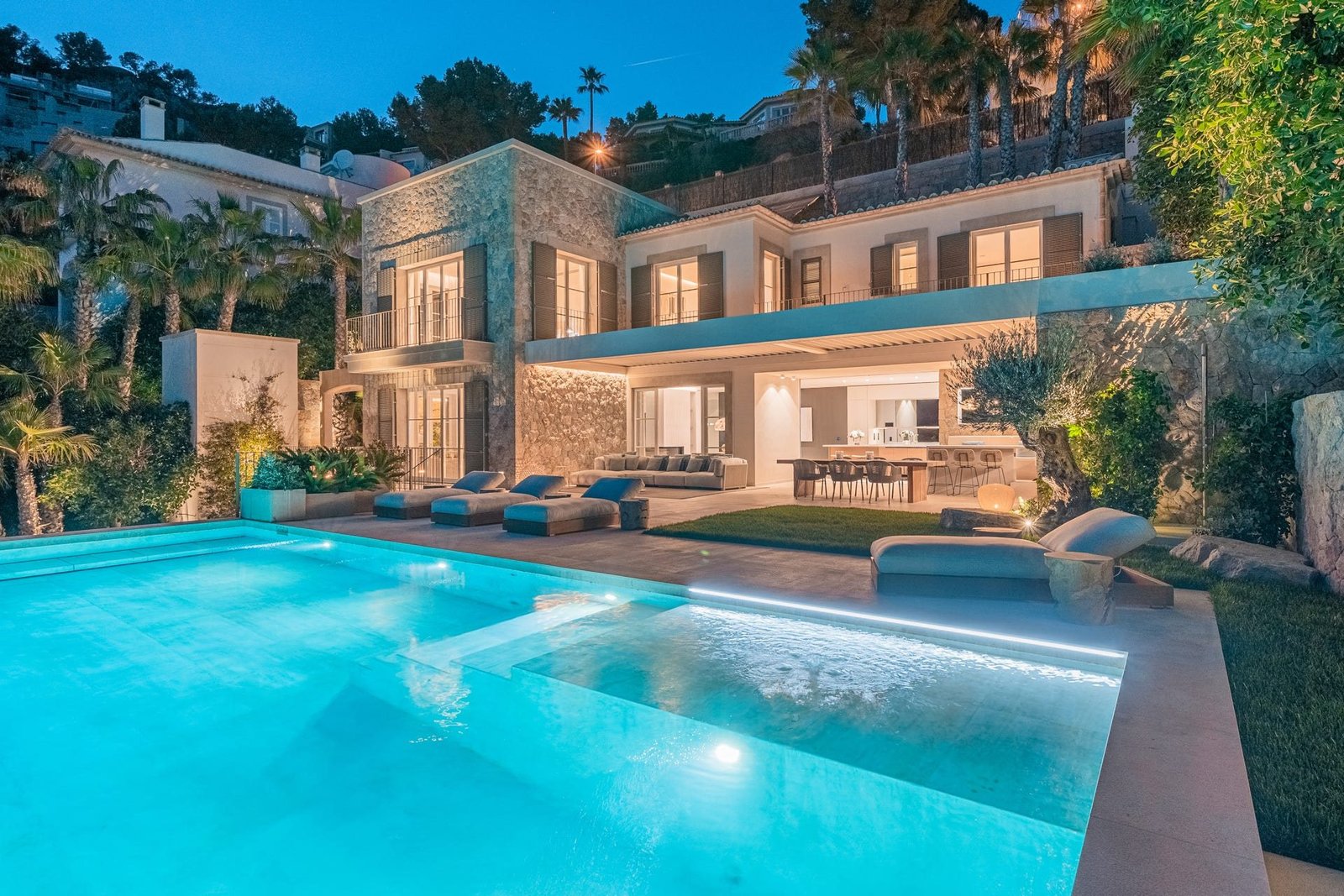 Villa swimming pool and garden at night, Mallorca